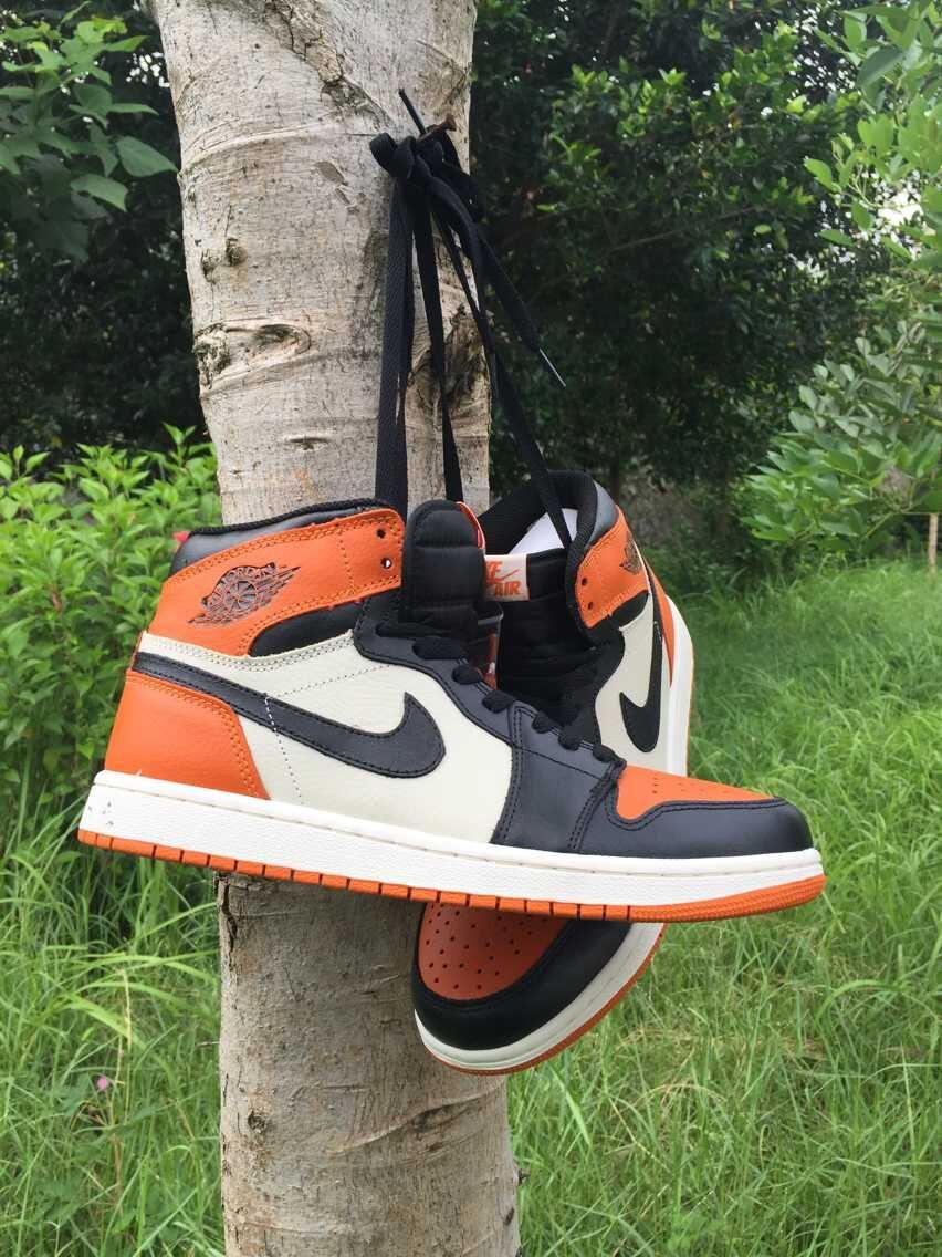 Jordan 1 High Sneakers in Black, in White and Orange - product image from the listing.