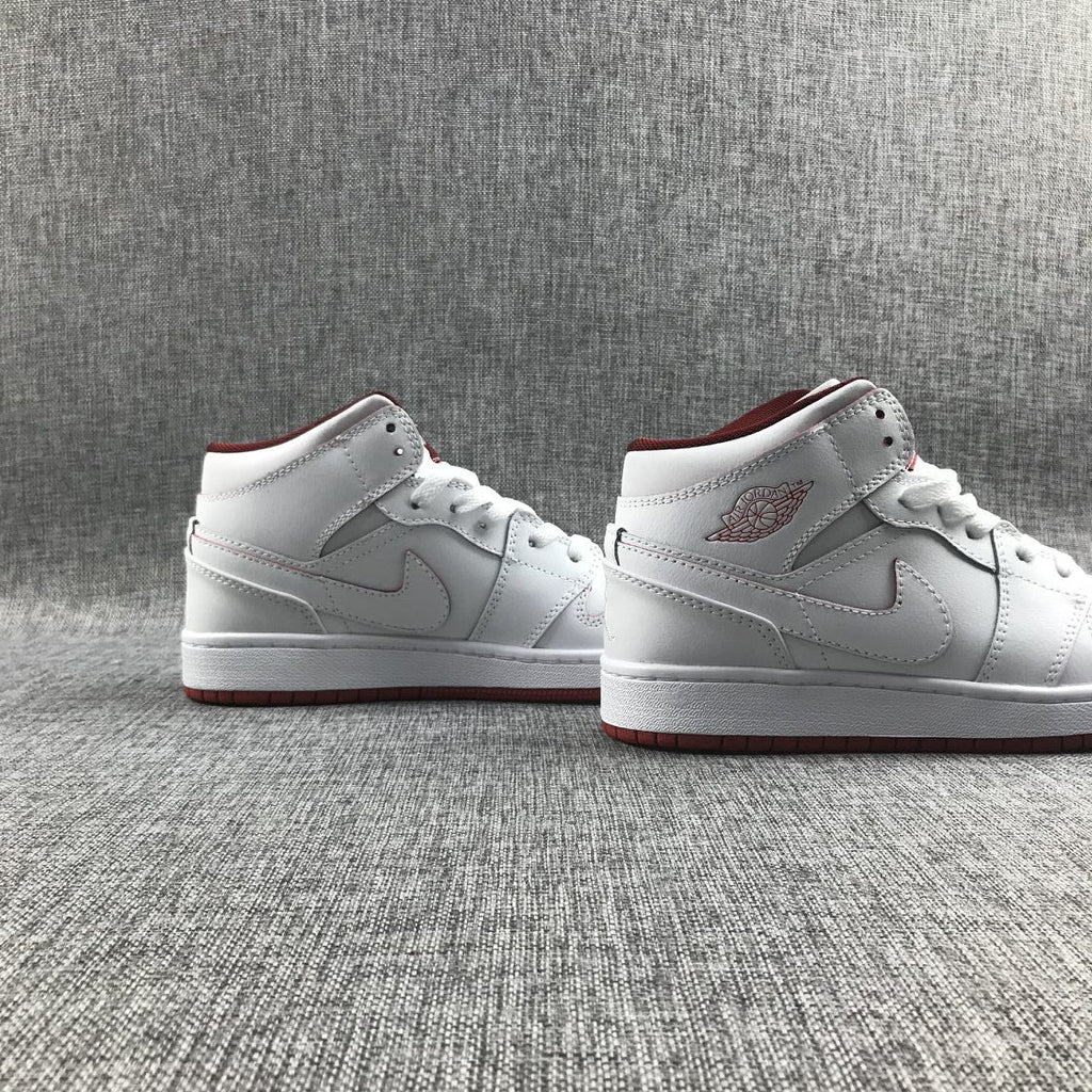Air Jordan 1 Mid Sneakers in White and Red 554725-103 - product image from the listing.