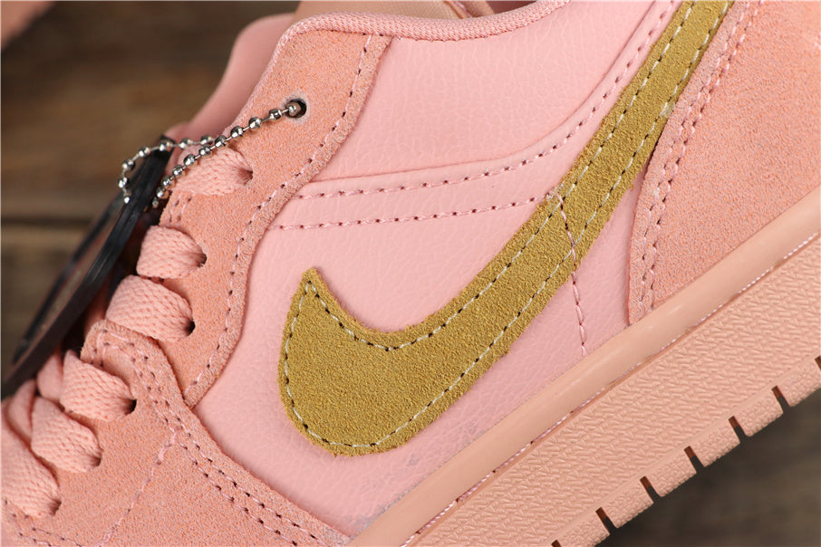 Air Jordan 1 Low Sneakers in Coral Pink CJ9216-676 - product image from the listing.