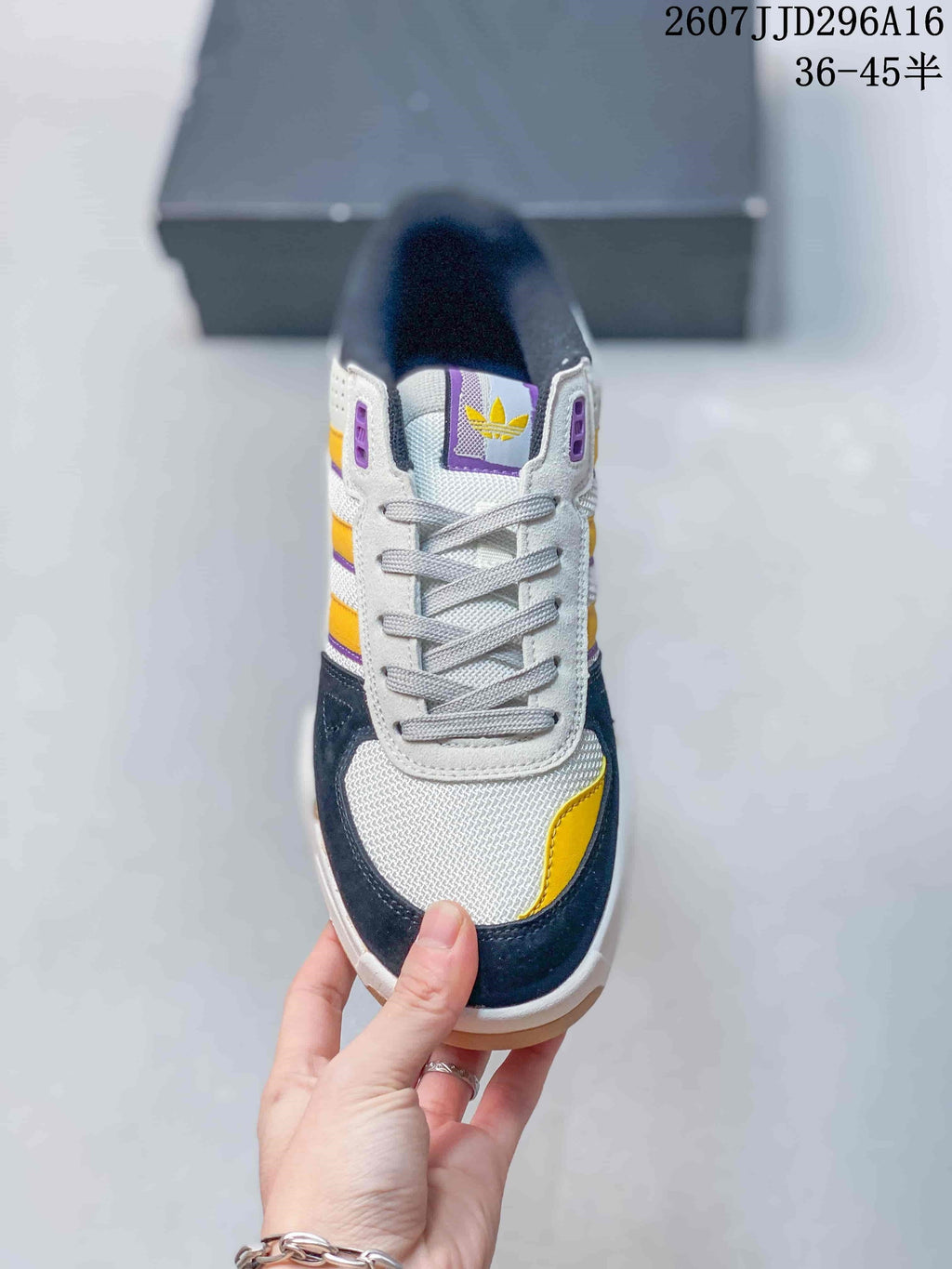 adidas Tekkira Cup Sneakers in White Navy Yellow JJD296A16 - product image from the listing.