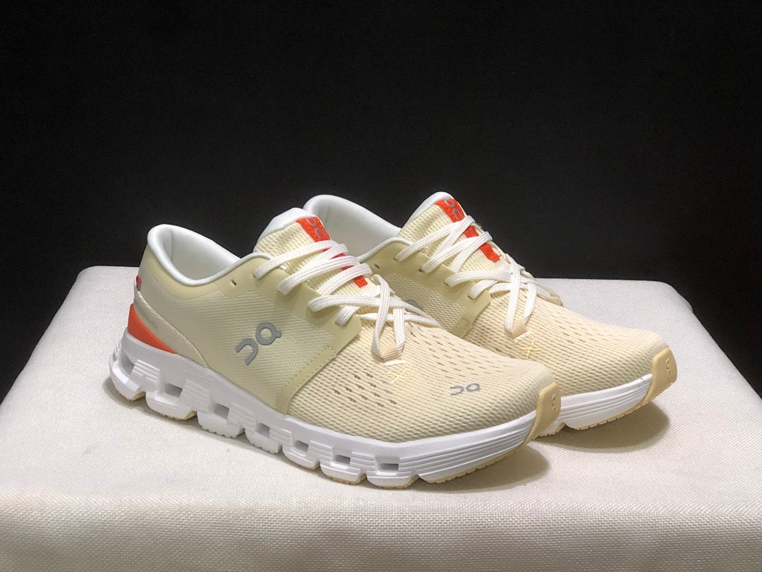 Cream and Orange On Cloud X 4 Sneakers - product image from the listing.