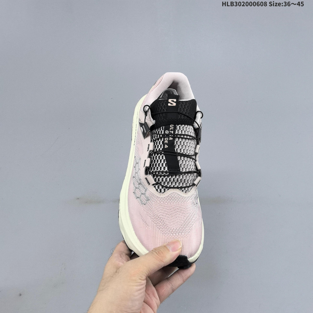 Salomon Ultra Glide 4 Trail Running Shoes, in Pink and Cream - product image from the listing.