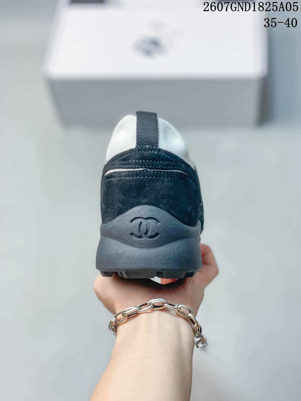 Chanel Low-Top Sneakers in Black and White 2607GND1825A05 - product image from the listing.