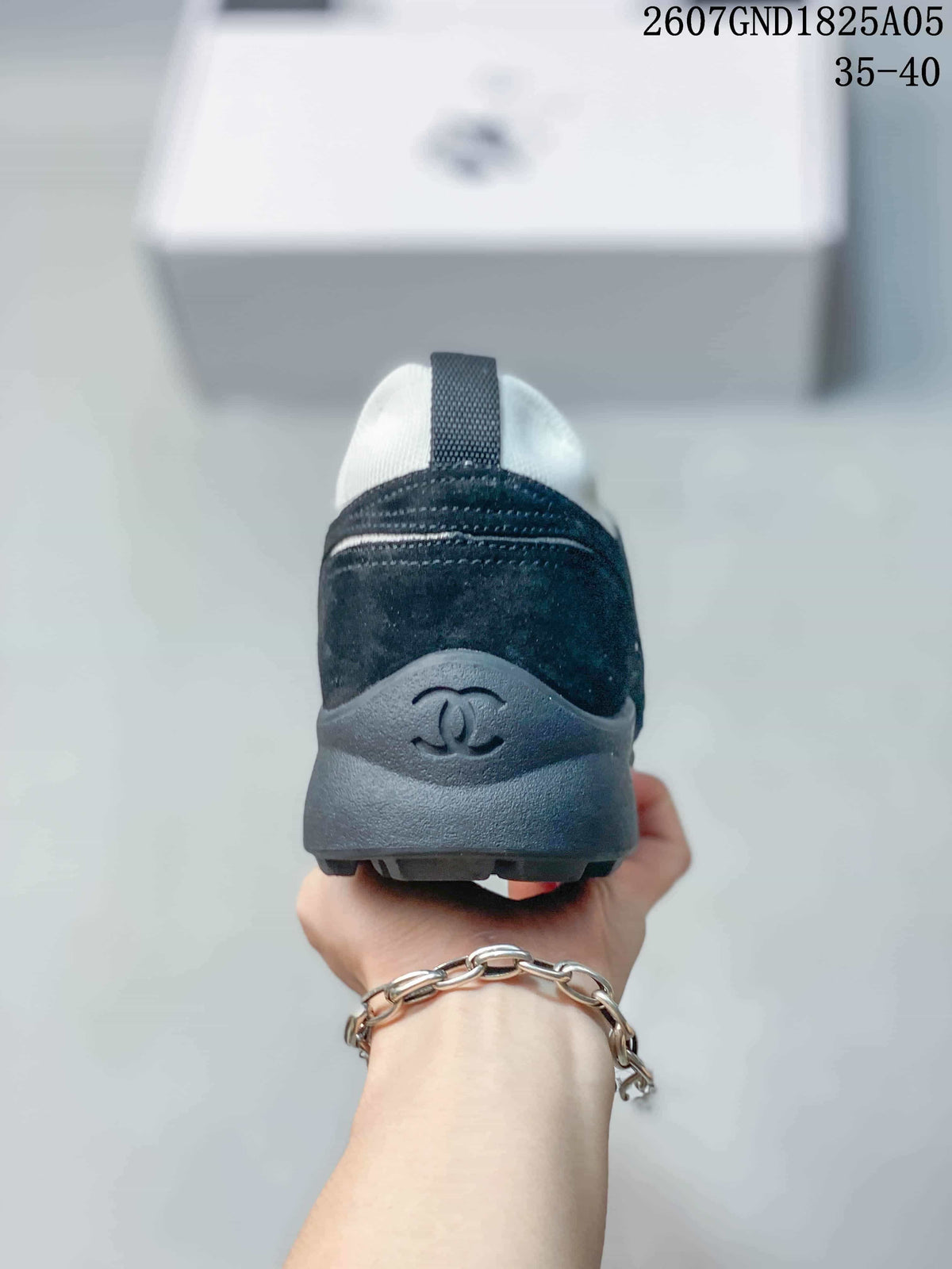 Chanel Low-Top Sneakers in Black and White 2607GND1825A05 - product image from the listing.