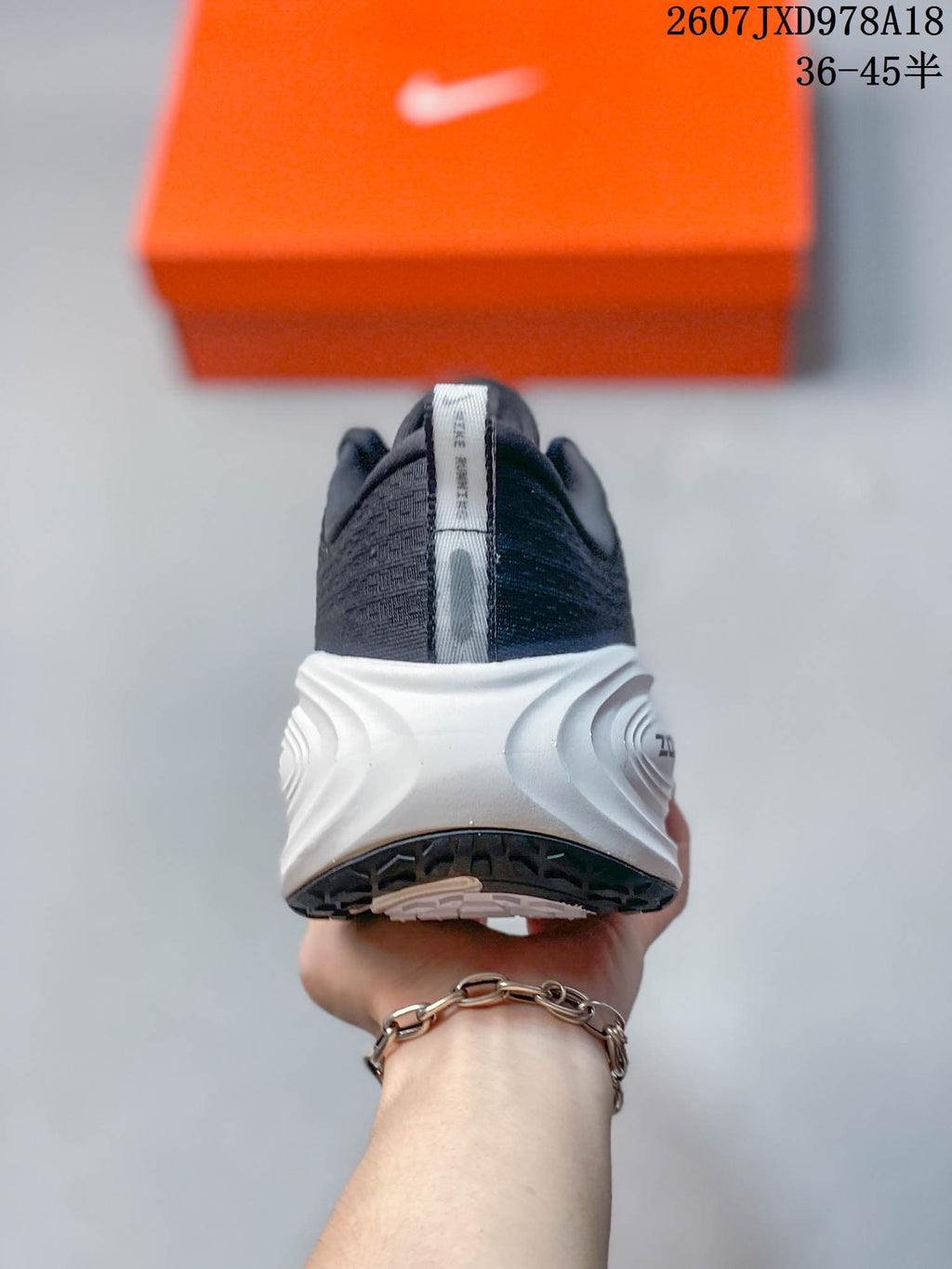 Nike Vomero Plus Running Sneakers in Dark Gray White 2607JXD978A18 - product image from the listing.