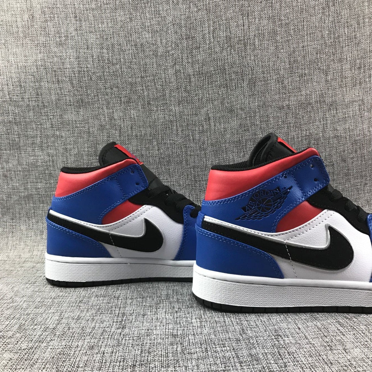 Air Jordan 1 Mid Sneakers in Blue Red Black White - product image from the listing.