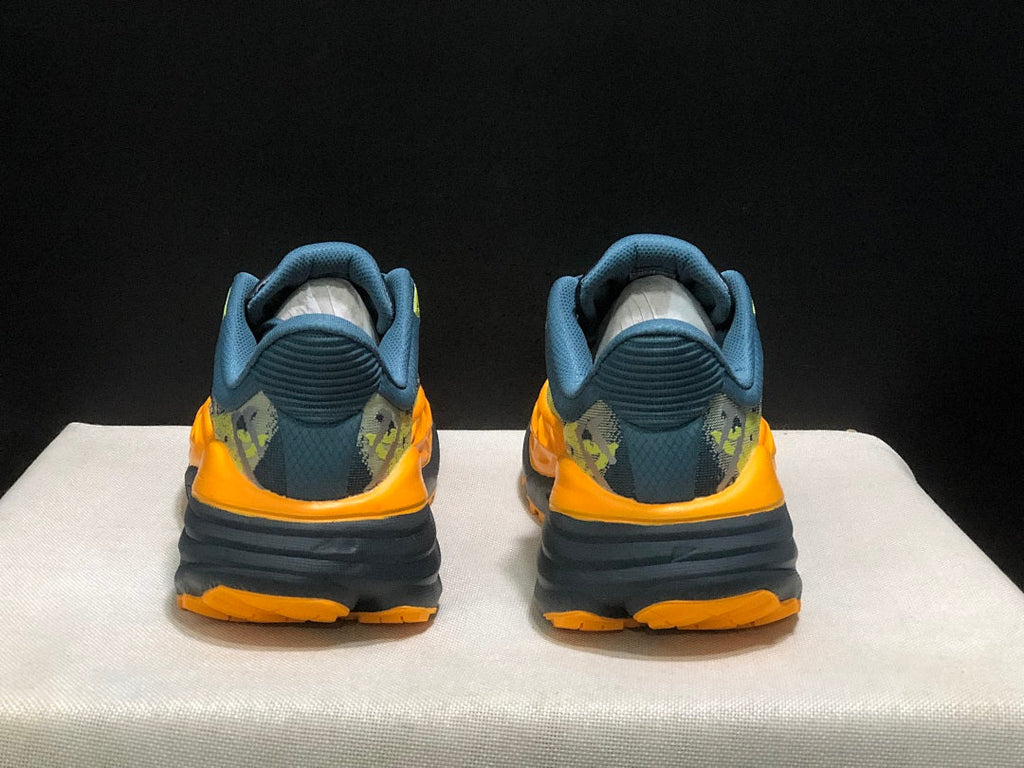 HOKA Stinson 7 Trail Running Shoes in Blue Yellow Orange - product image from the listing.