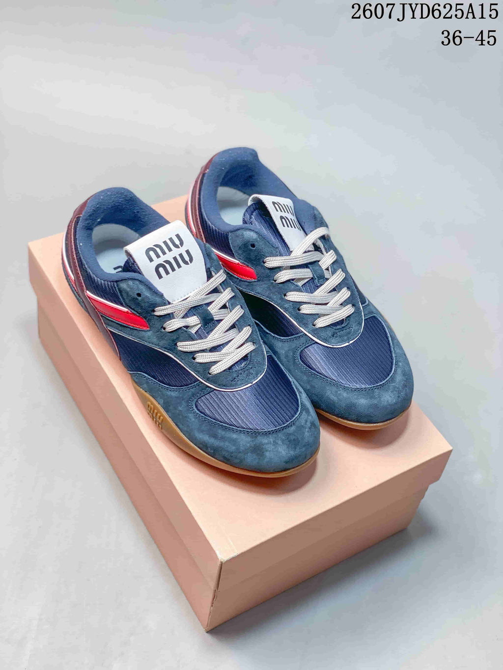 Miu Miu Gymnasium Low-Top Sneakers in Navy Red 2607JYD625A15 - product image from the listing.