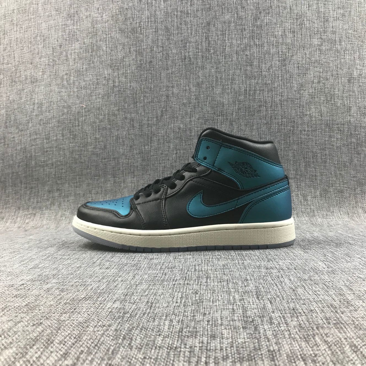 Air Jordan 1 Mid BQ6472-009 Sneakers in Black and Turquoise - product image from the listing.