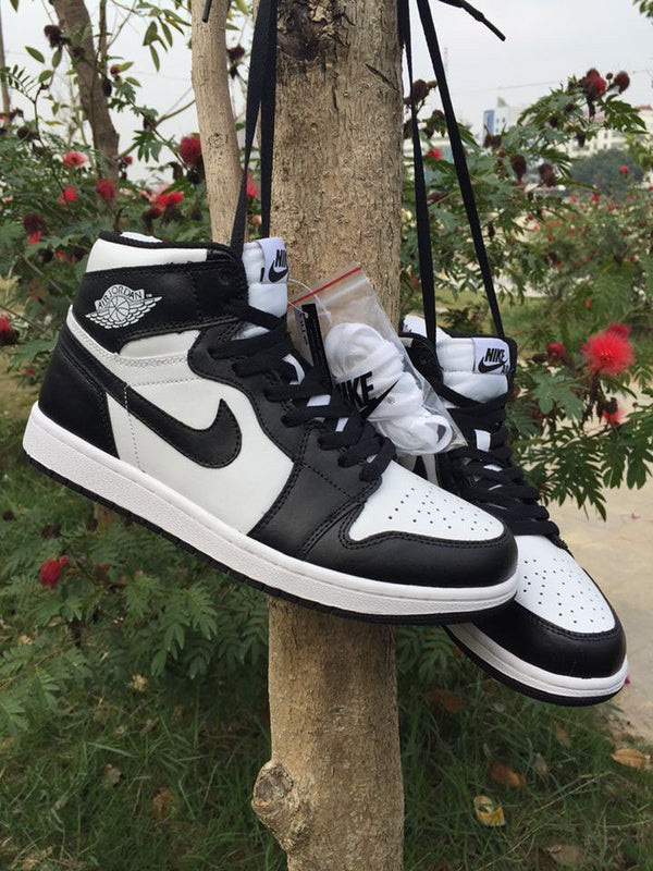 Jordan 1 High Sneakers in Black and White - product image from the listing.