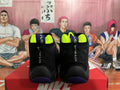 Nike The Glove Basketball Sneakers in Black Purple Yellow - product image from the listing.