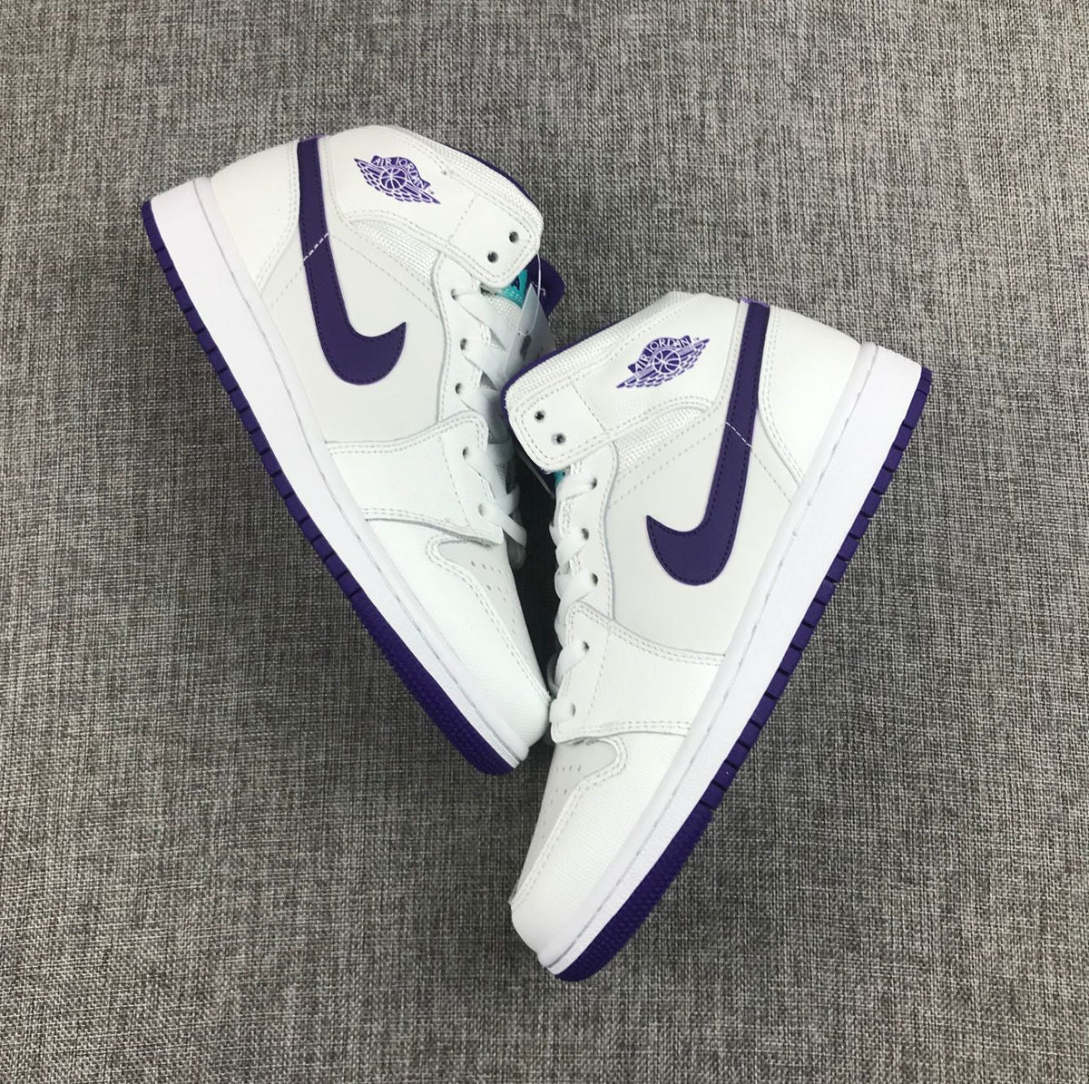 Air Jordan 1 Mid Sneakers in White Purple 332148-137 - product image from the listing.