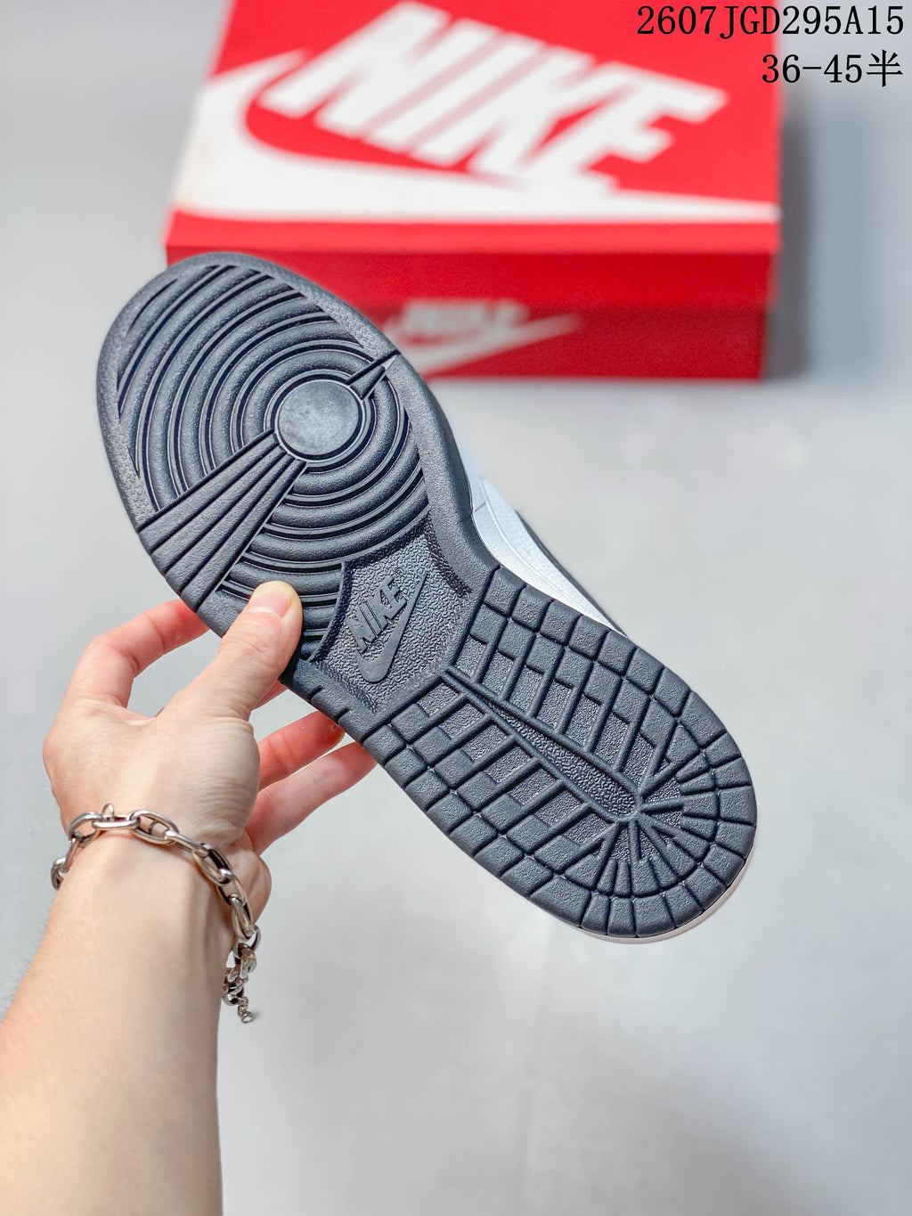 Nike SB Dunk Low Pro Sneakers in White Black 2607JGD295A15 - product image from the listing.
