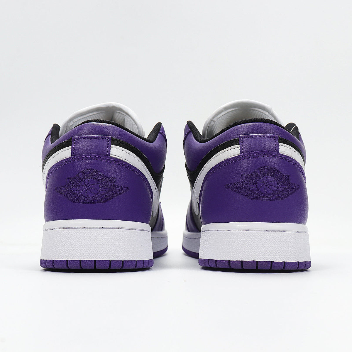 Jordan 1 Low Sneakers in Black Purple White 553560-501 - product image from the listing.