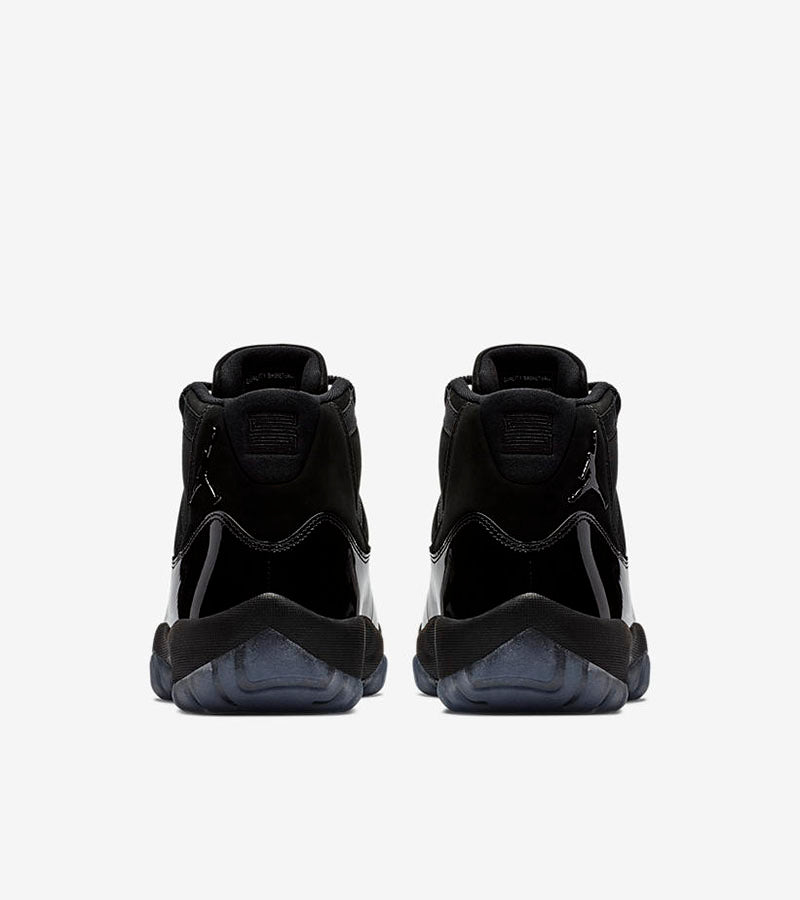 Air Jordan 11 Cap and Gown High-Top Sneakers in Black - product image from the listing.