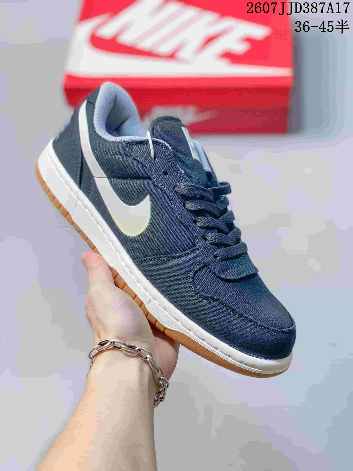 Nike Big Nike Low Sneakers in Black, Green, in White and Navy - product image from the listing.