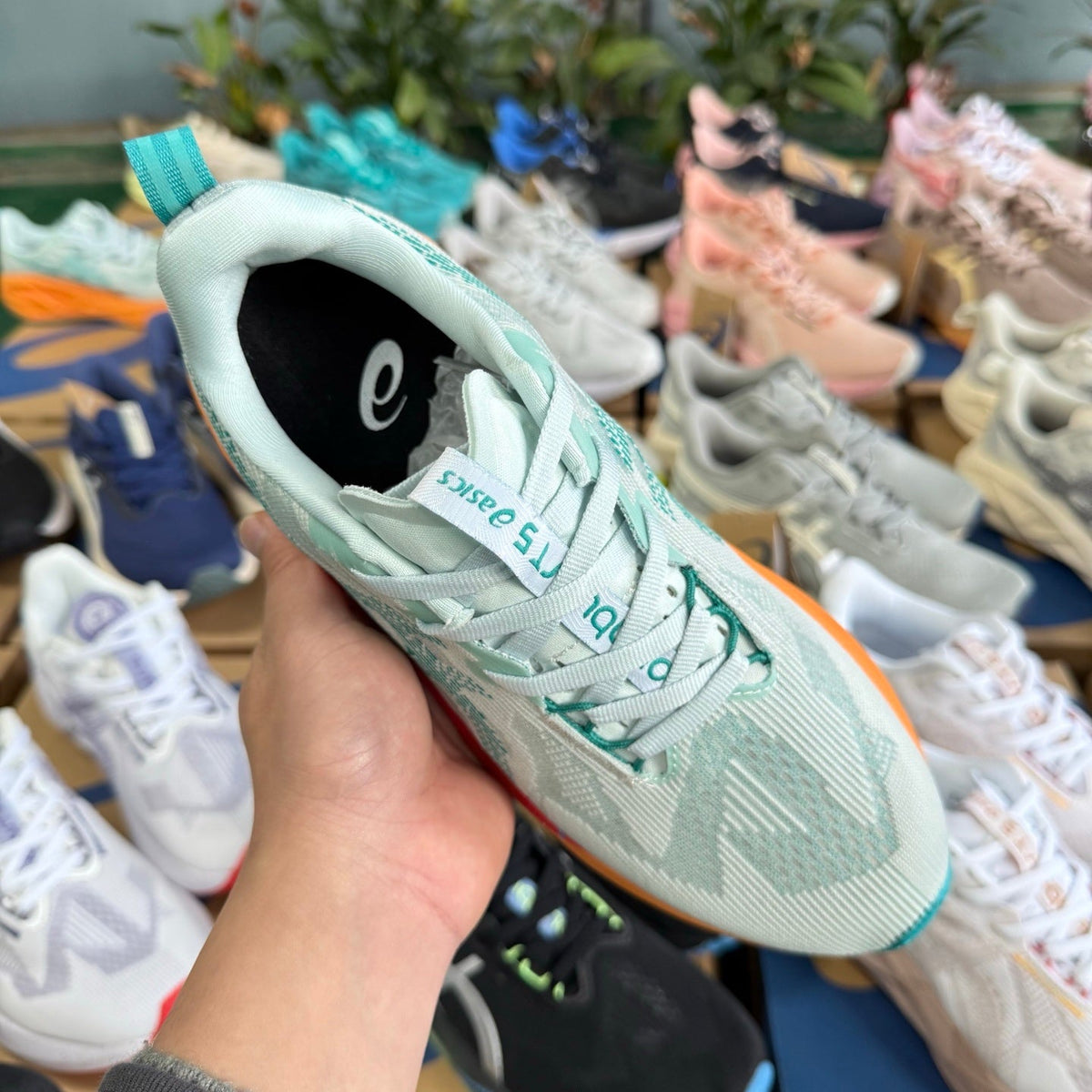 ASICS NOVABLAST 5 LE Running Shoes in White Orange - product image from the listing.