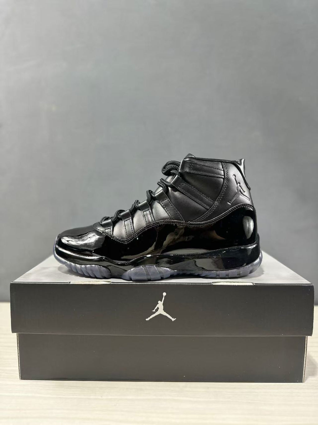 Comme des Garçons × Jordan Air Jordan 11 Sneakers in Black - product image from the listing.