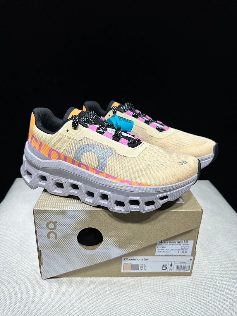 On Cloudmonster Running Shoes, in Pale Yellow and Orange - product image from the listing.