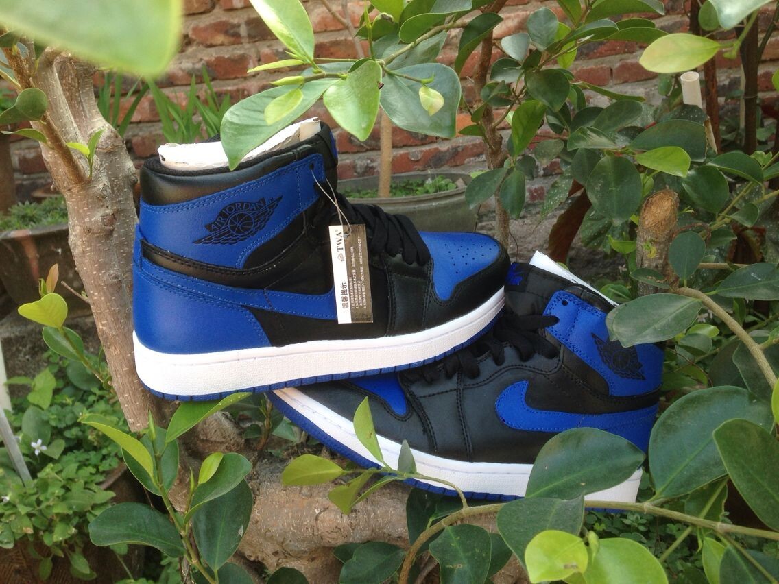Jordan 1 High Basketball Sneakers in Blue and Black - product image from the listing.
