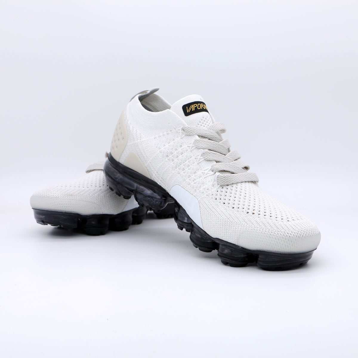 Nike Air VaporMax Flyknit Sneakers in White Gold Black 942842-010 - product image from the listing.