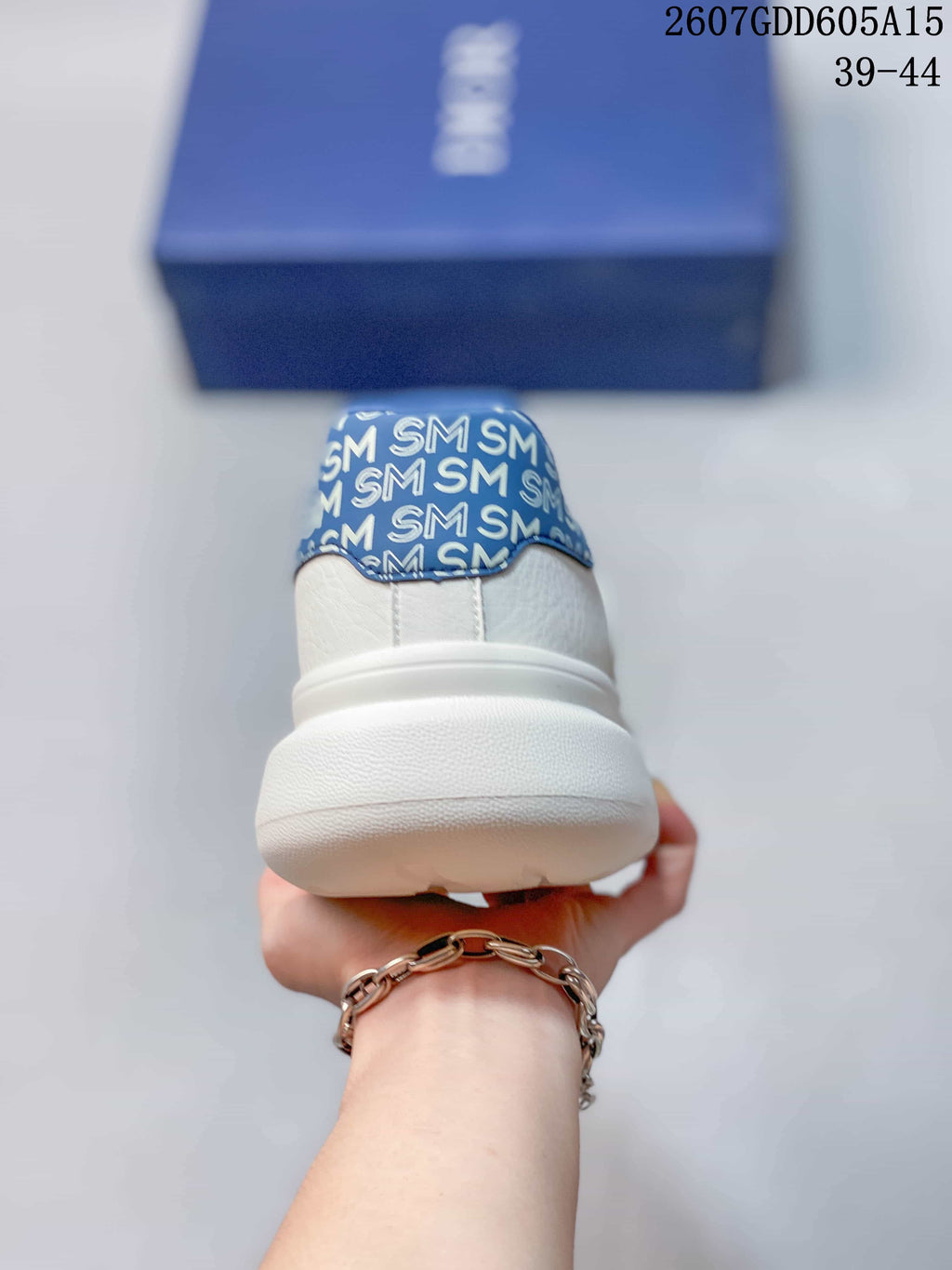 Dior Low-Top Sneakers in White and Blue 2607GDD605A15 - product image from the listing.