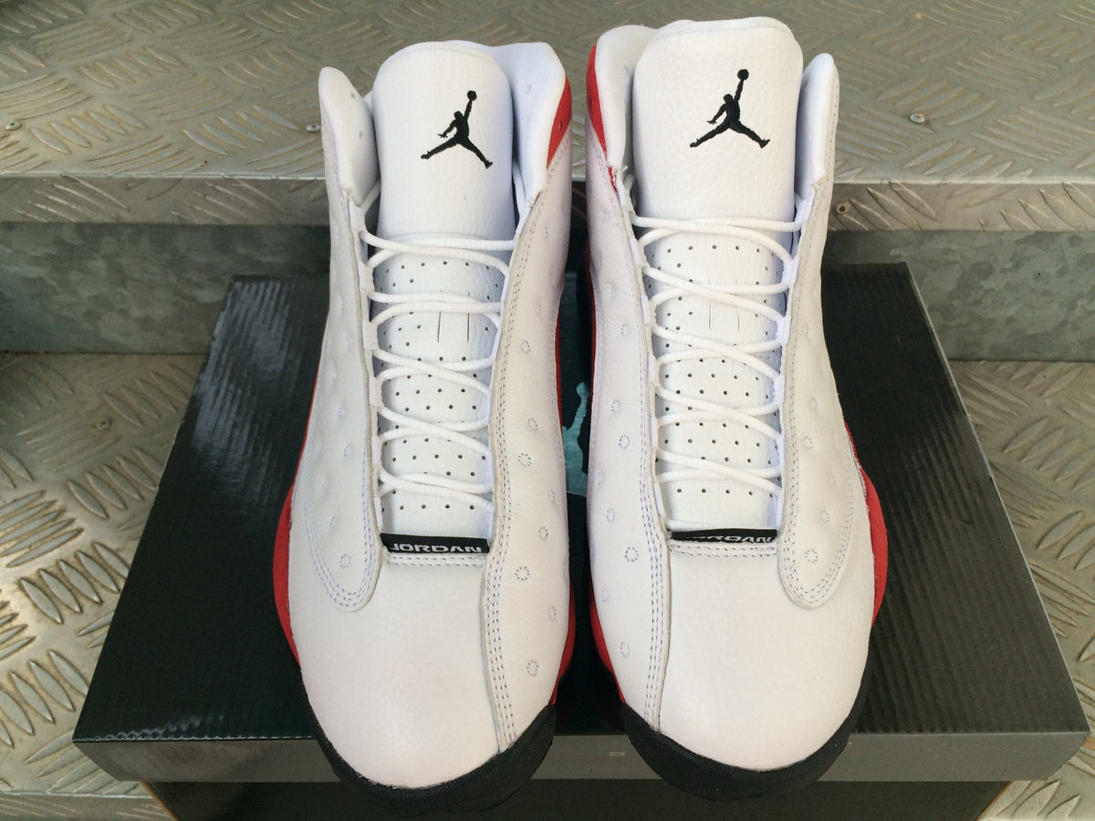 Air Jordan 13 Sneakers in White Red Black - product image from the listing.