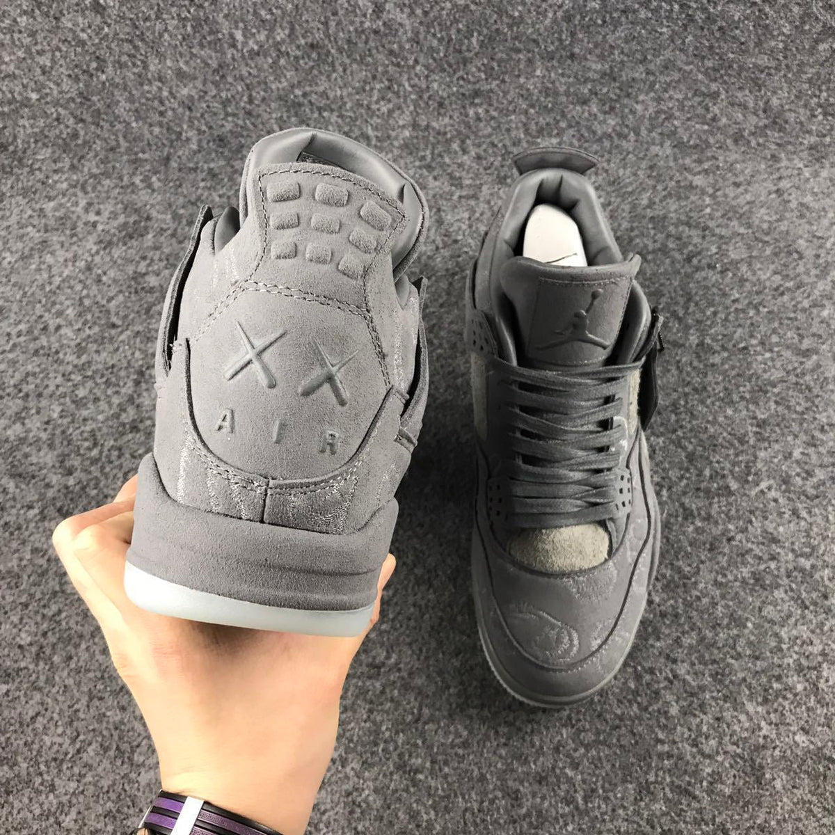Grey Jordan 4 KAWS Sample High-Top Sneakers - product image from the listing.