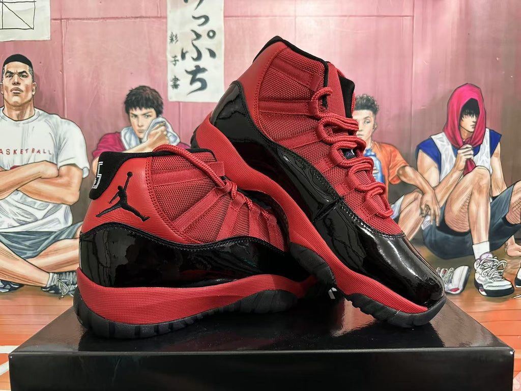 Jordan 11 High-Top Sneakers in Black and Red - product image from the listing.