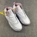 Air Jordan 12 Cherry Blossom Pink Sneakers - product image from the listing.