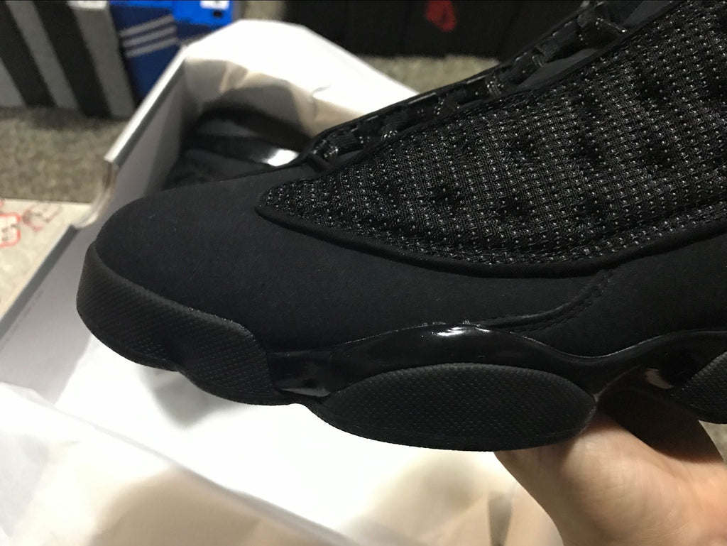 Air Jordan 13 Retro Black Cat Basketball Sneakers in Black - product image from the listing.