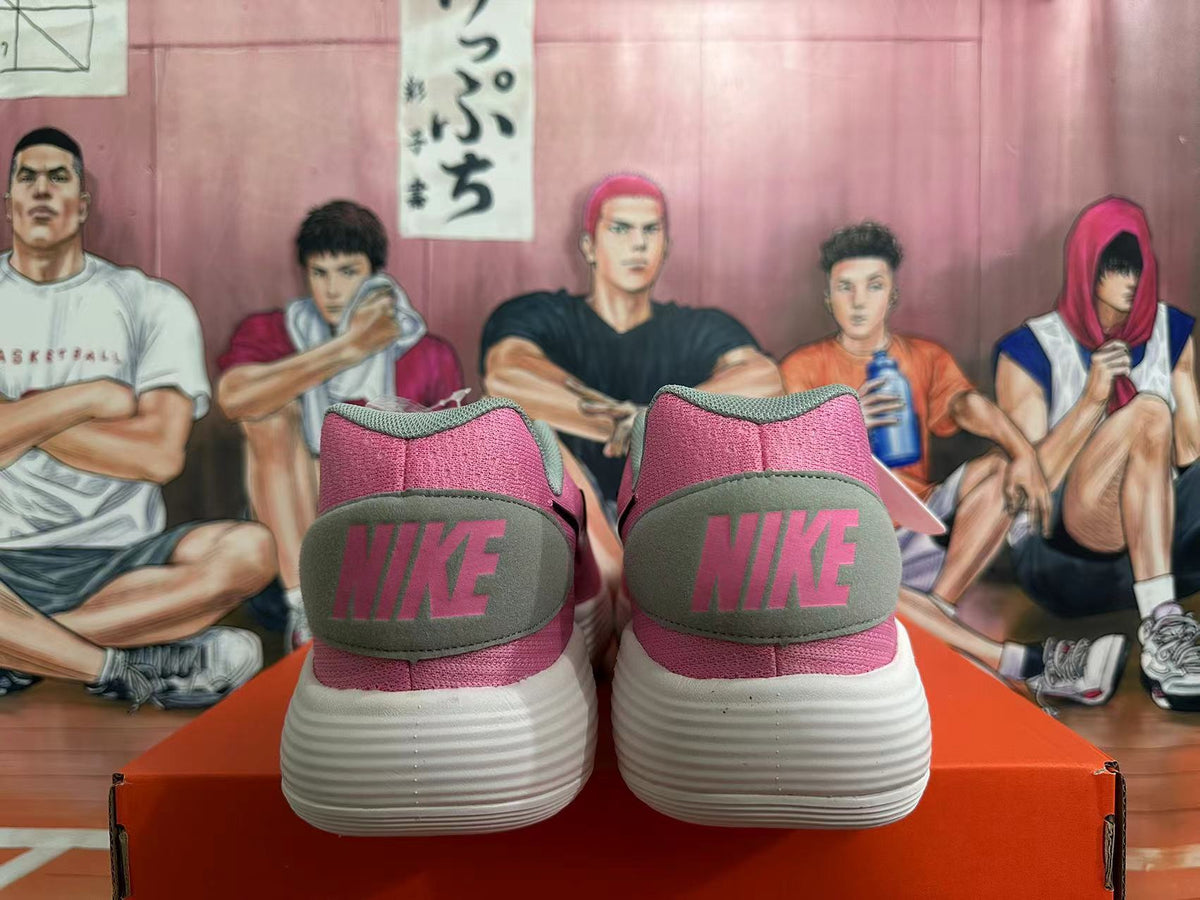 Nike Low-Top Sneakers in Pink and Grey - product image from the listing.