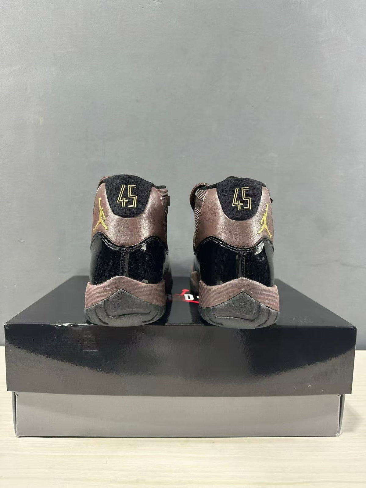 Air Jordan 11 Retro Black Bronze High-Top Sneakers - product image from the listing.