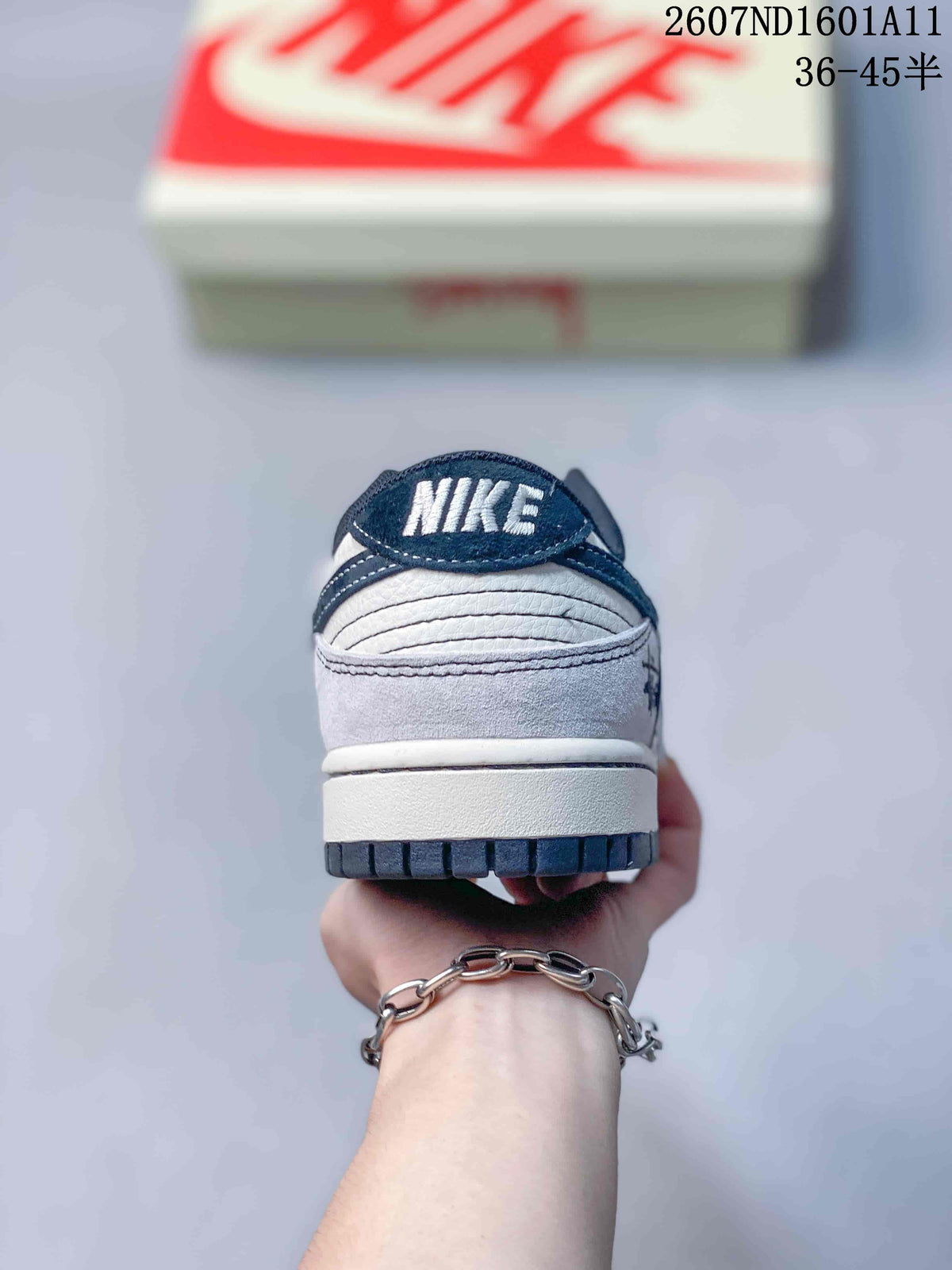 Nike SB Dunk Low Sneakers in Off-White White Navy 2607ND1601A11 - product image from the listing.