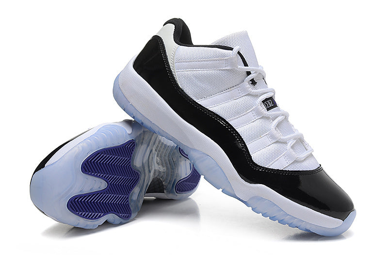 Air Jordan 11 Low Basketball Sneakers in White Black - product image from the listing.