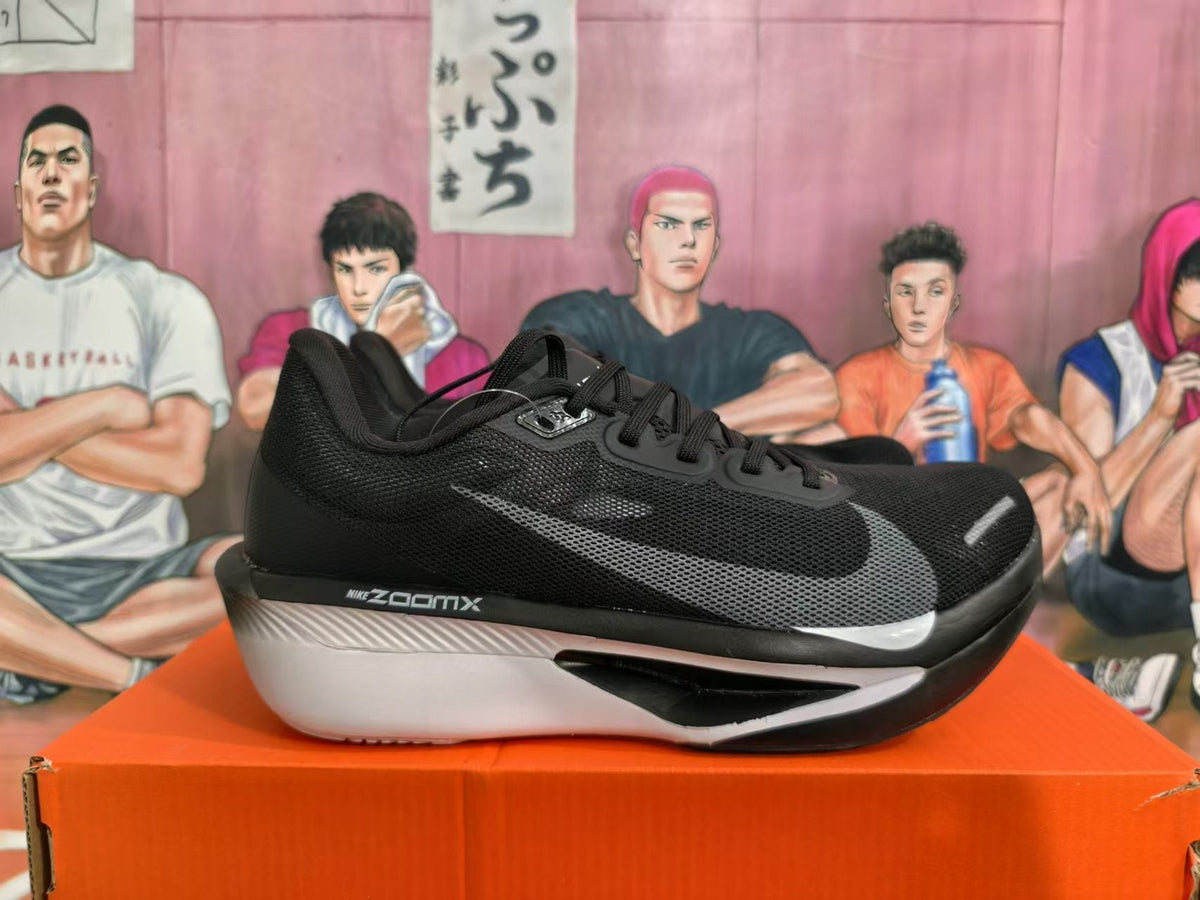 Nike ZoomX Running Shoes in Black and White - product image from the listing.
