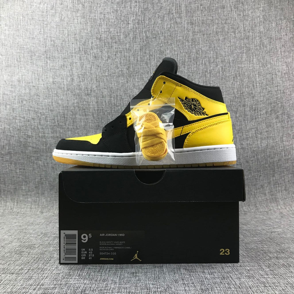 Air Jordan 1 Mid Sneakers in Black and Yellow - product image from the listing.