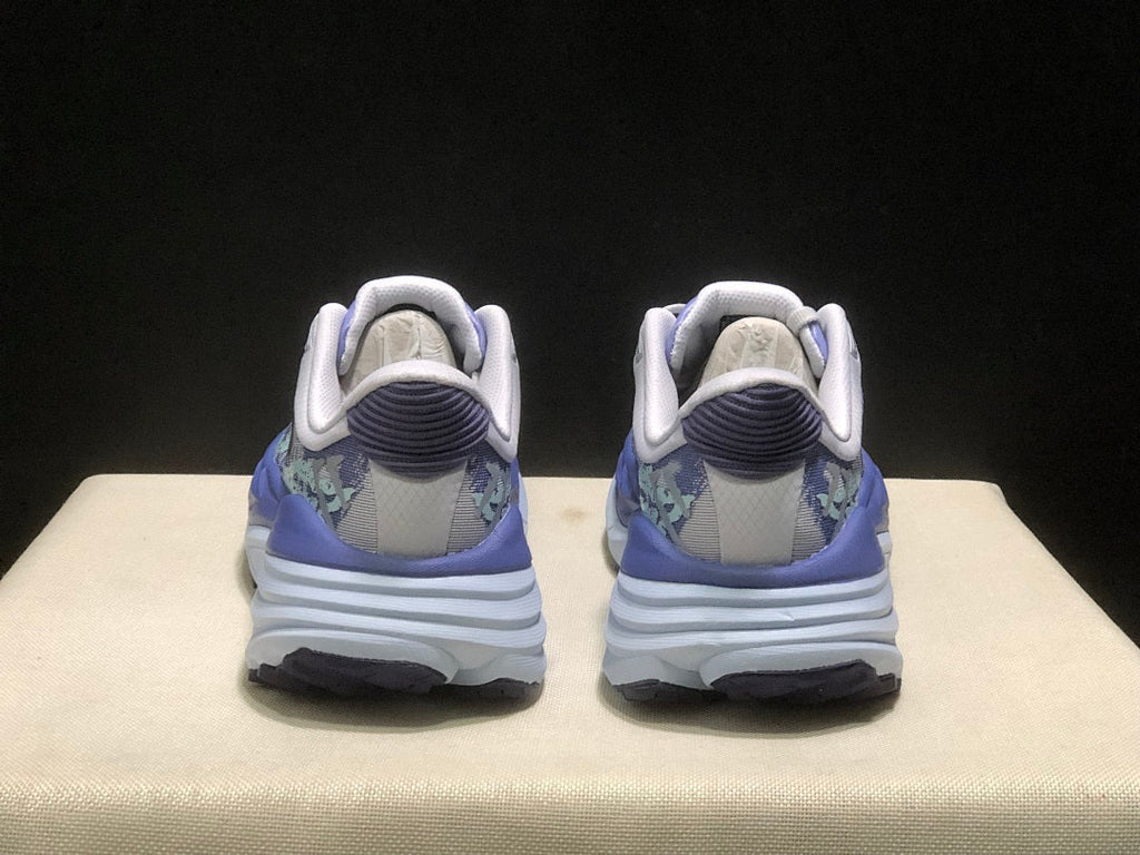Purple and Mint HOKA Stinson 7 Running Shoes - product image from the listing.