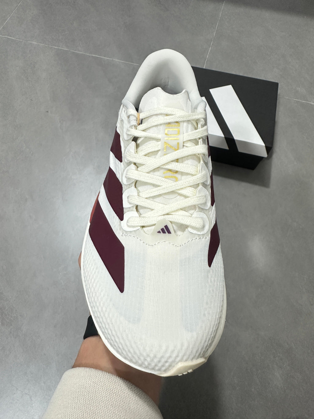 White and Burgundy Adidas Lightstrike Pro Running Shoes - product image from the listing.