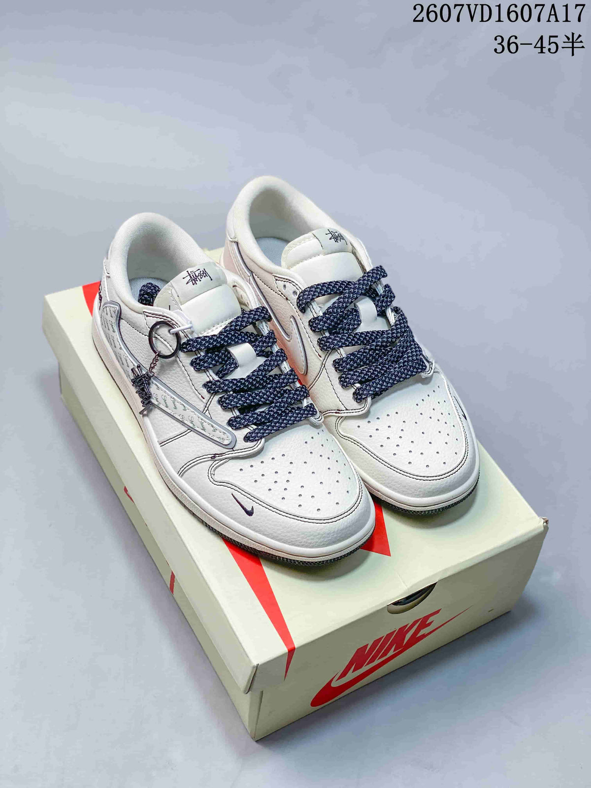 Jordan 1 Low Travis Scott x Stussy Sneakers in White Gray - product image from the listing.