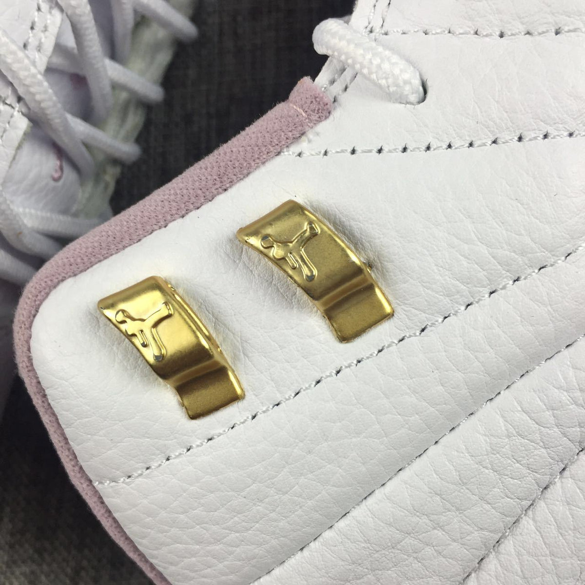 Air Jordan 12 Cherry Blossom Pink Sneakers - product image from the listing.