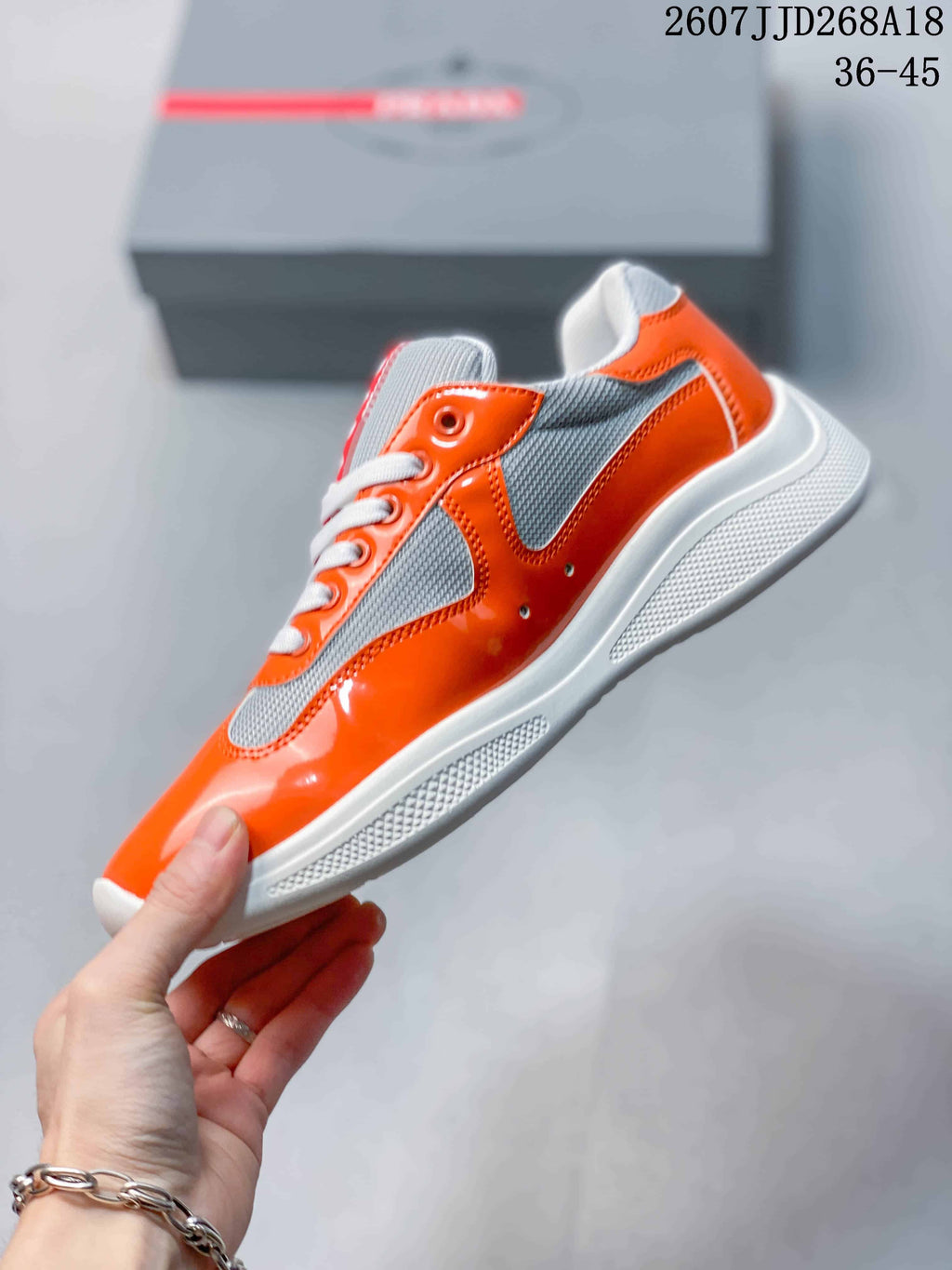 Prada America's Cup Orange Low-Cut Lace-Up Sneakers - product image from the listing.