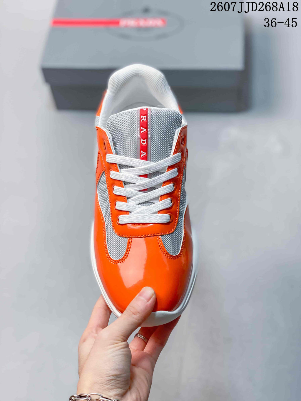 Prada America's Cup Orange Low-Cut Lace-Up Sneakers - product image from the listing.