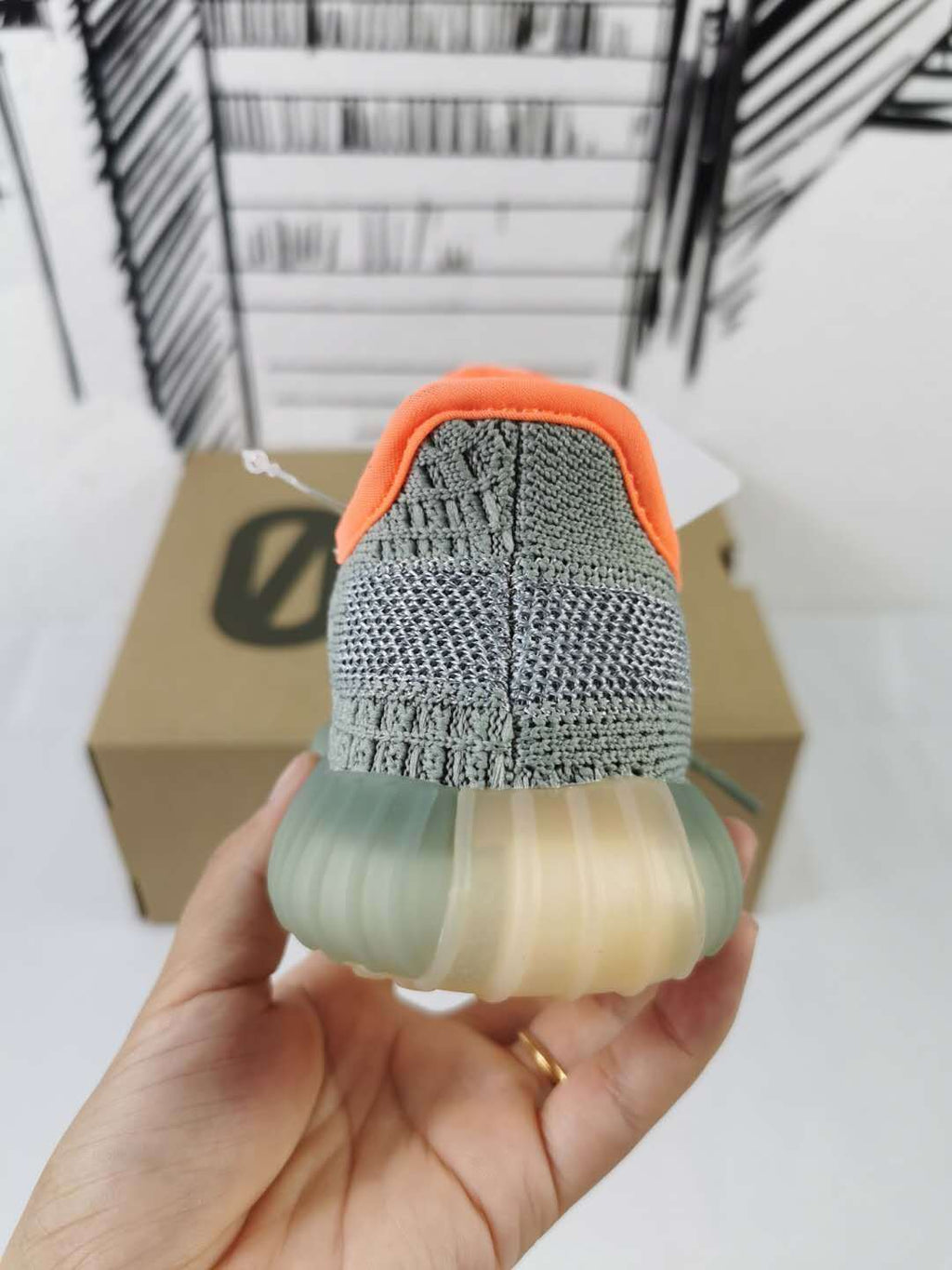 Grey and Orange Yeezy 350 V2 Kids Sneakers - product image from the listing.