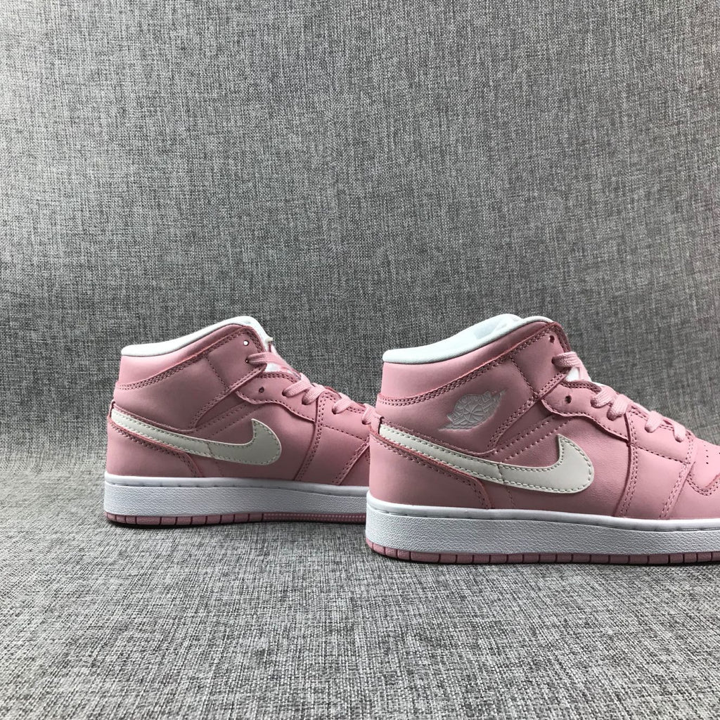 Women's Jordan 1 Mid Pink Sneakers 555112-100 - product image from the listing.