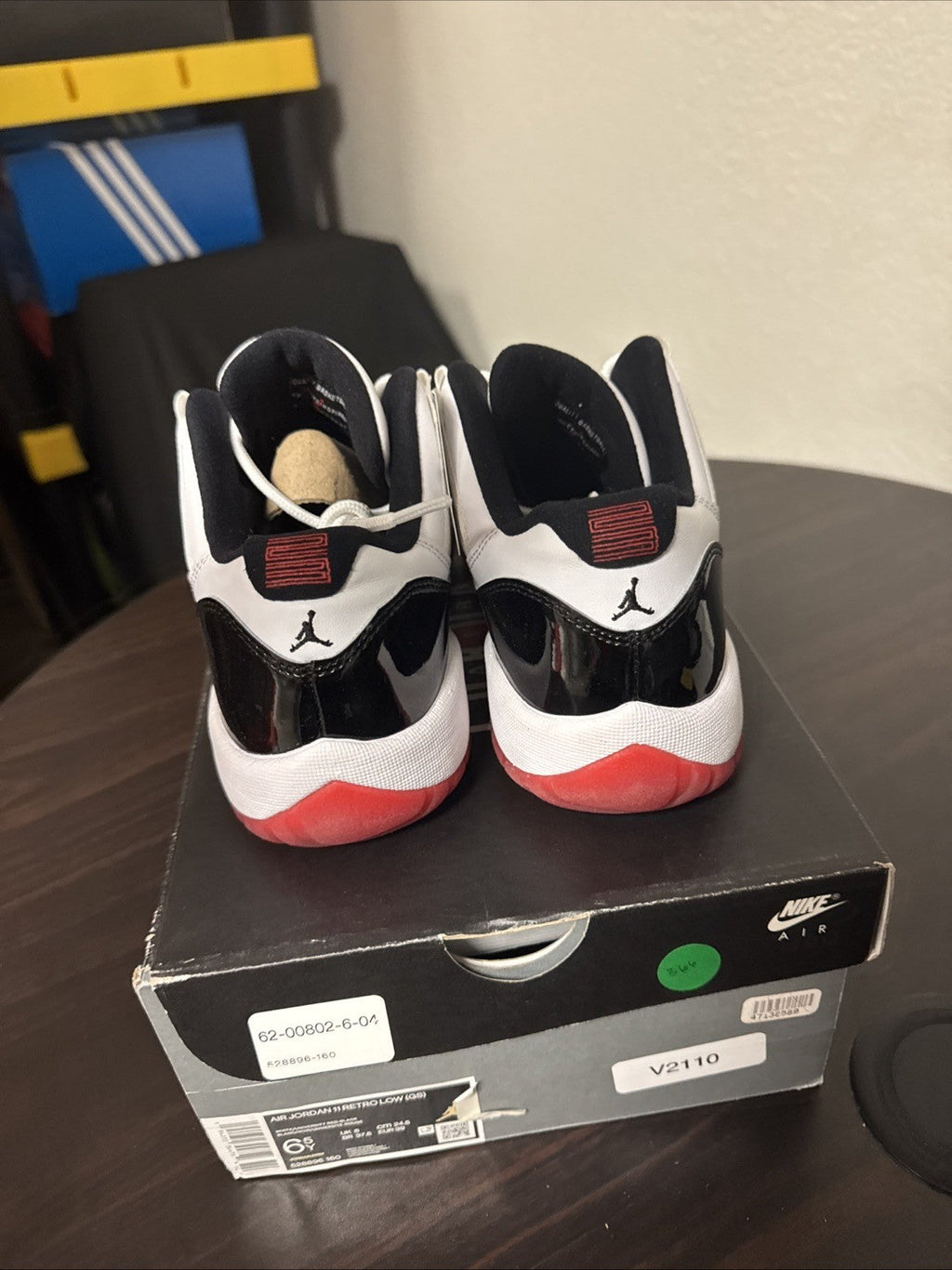 Concord Bred GS Size 6.5Y - Nike Air Jordan 11 Retro Low 528896-160 - product image from the listing.