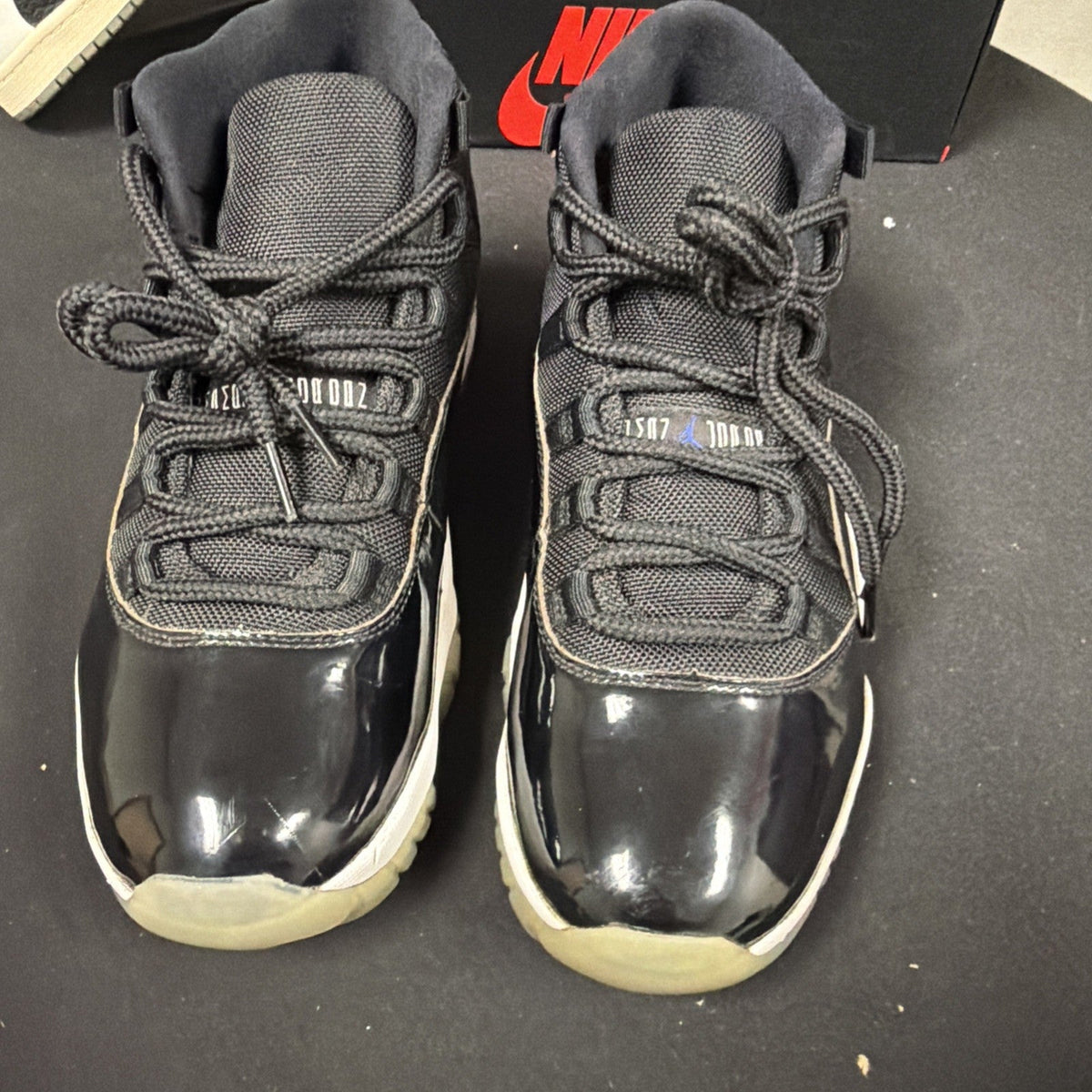 Air Jordan 11 Retro Space Jam High Top Sneaker Black White Concord - product image from the listing.