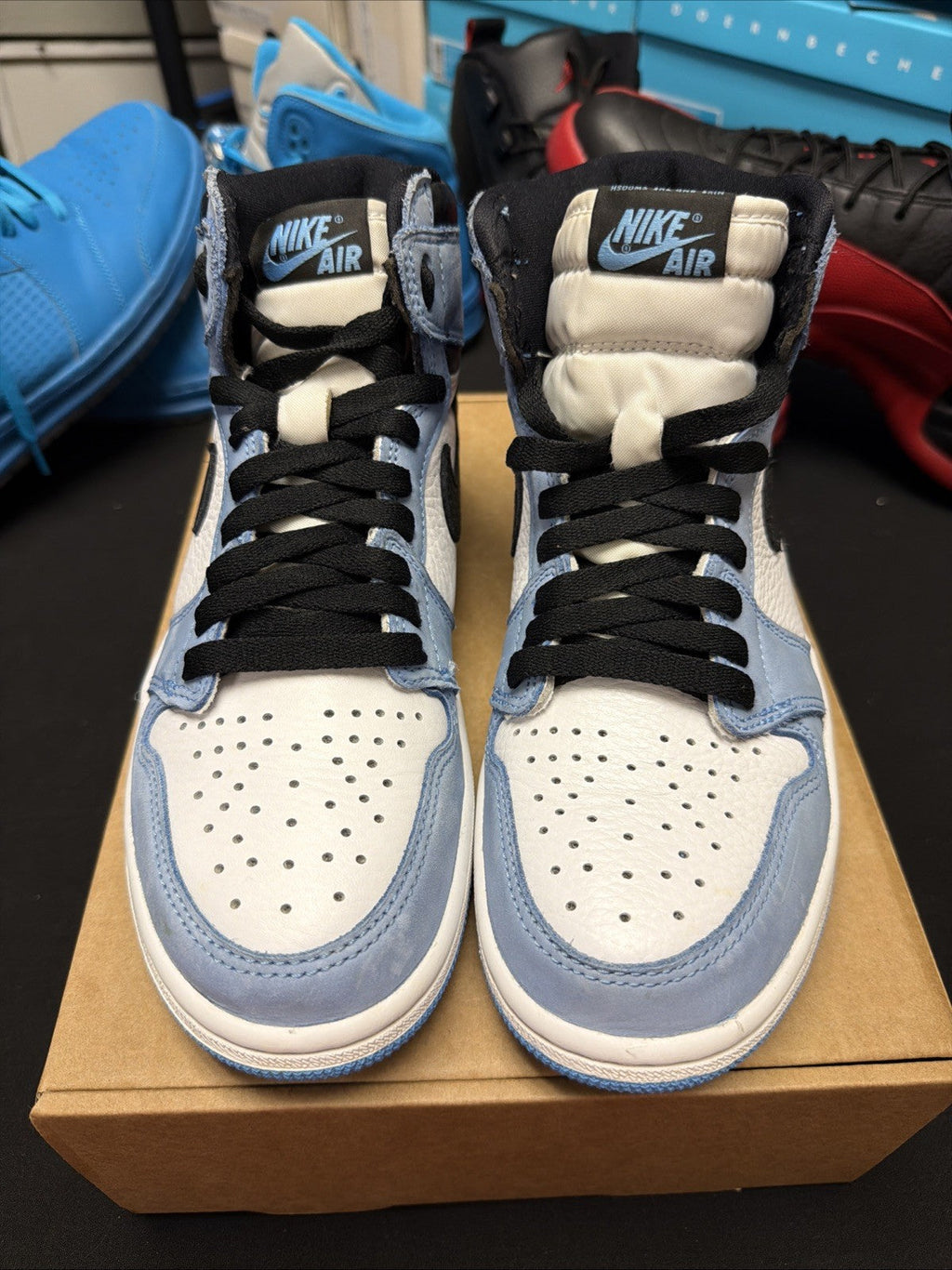 pair of Nike Air Jordan 1 Retro High OG Trainers in the "University Blue 6.5y - product image from the listing.