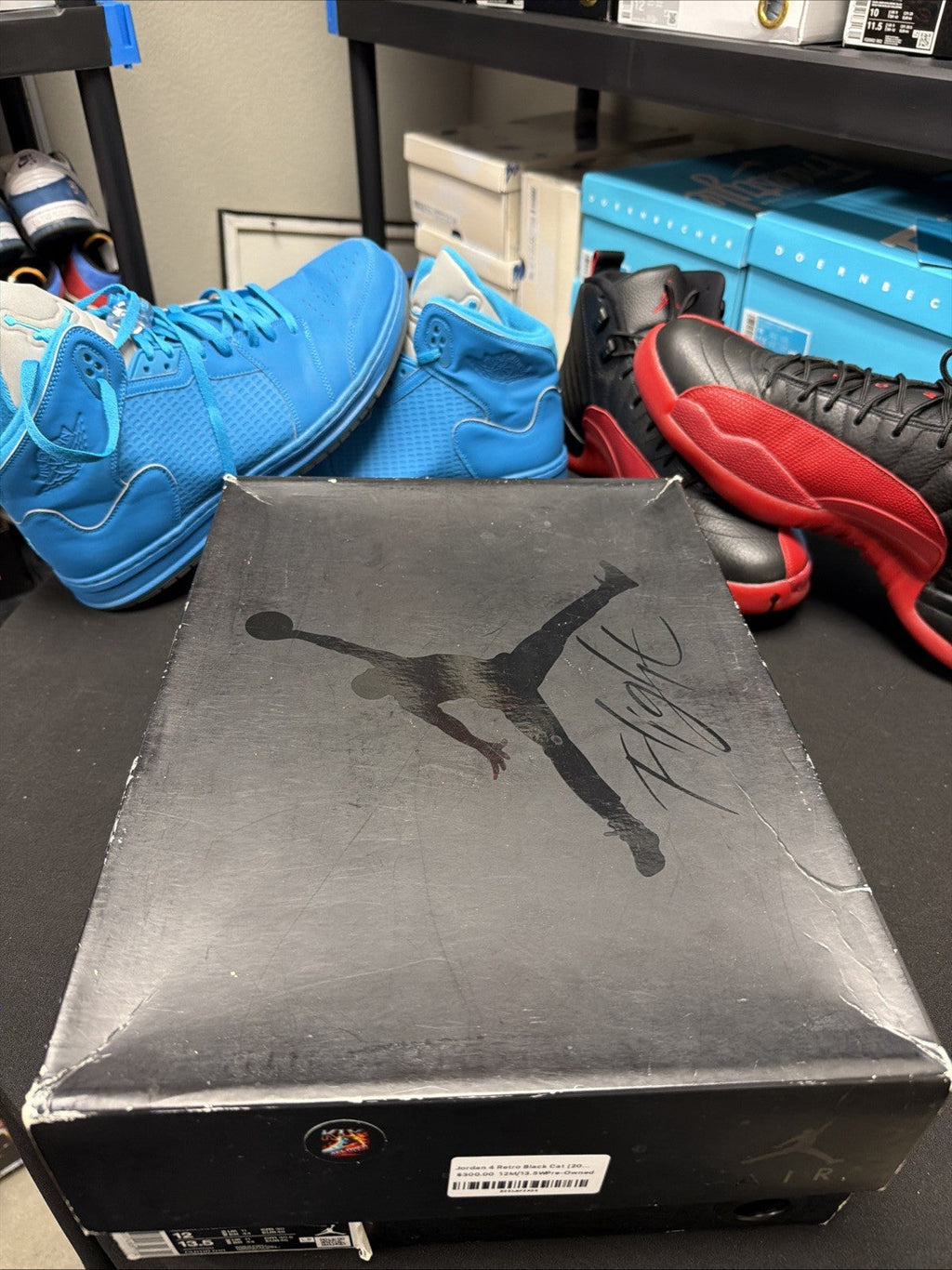 Jordan 4 Retro Mid Black Cat - Size 12 - product image from the listing.