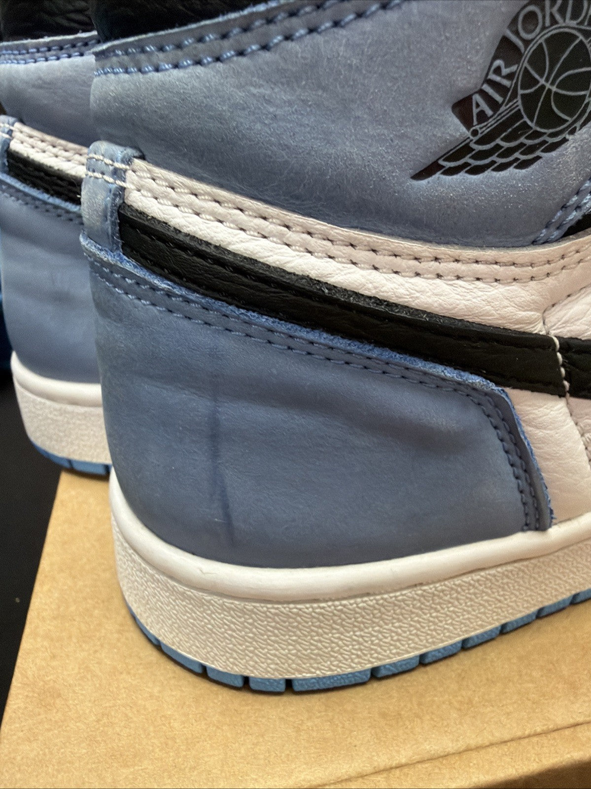 pair of Nike Air Jordan 1 Retro High OG Trainers in the "University Blue 6.5y - product image from the listing.